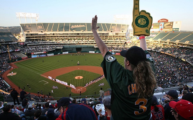OAKLAND, CA - APRIL 01:  An Oakland A's fan cheers before the start of the Opening Day game of the ...