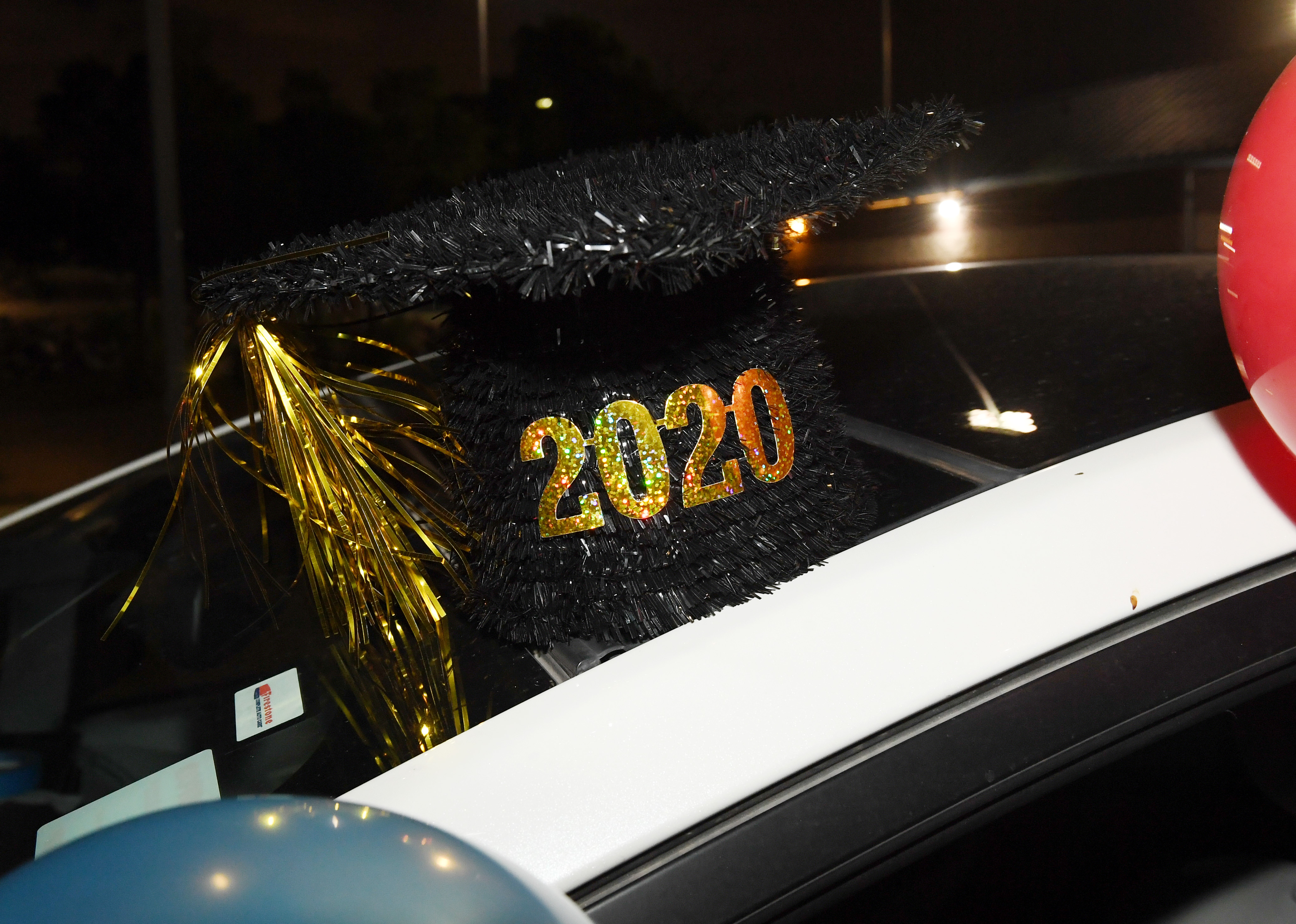 HENDERSON, NEVADA - APRIL 17:  Artwork of a graduation cap decorates a car at a celebration to reco...
